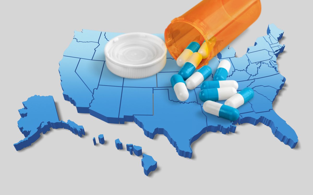 A map of the United States with a photograph of pills superimposed on it, to show the opioid epidemic.