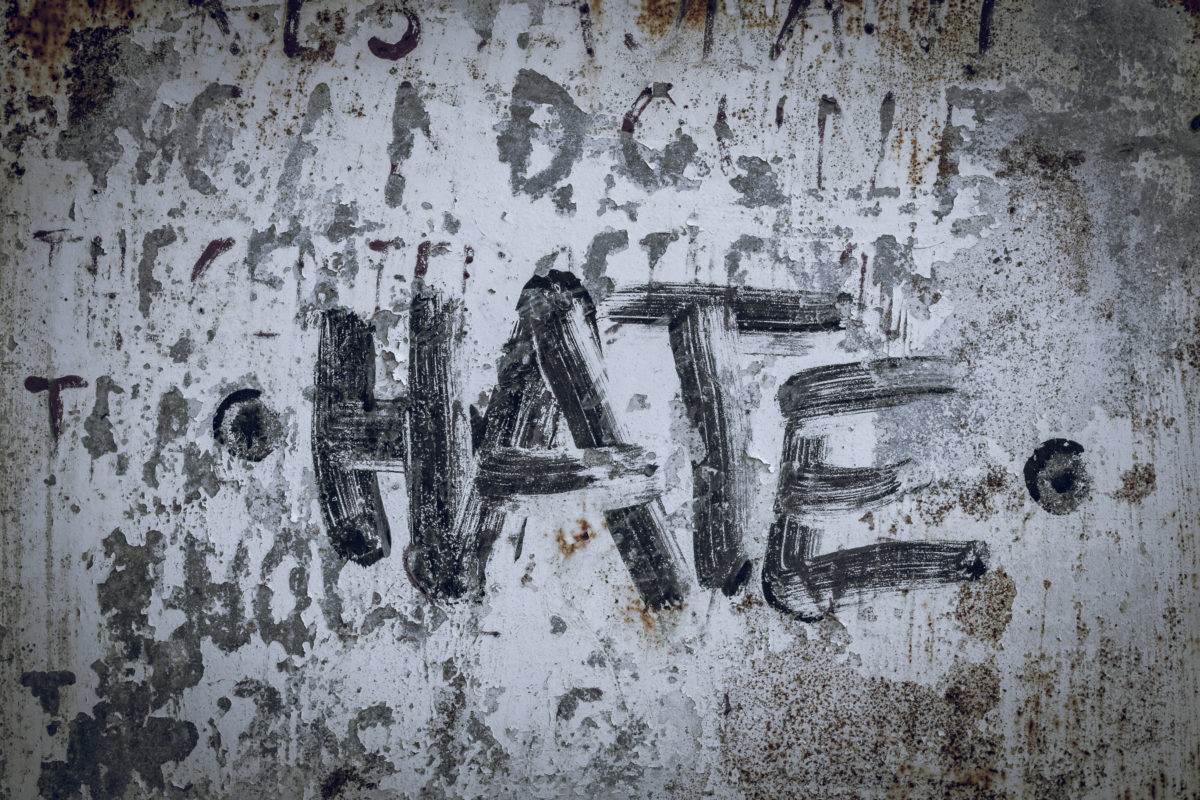 The word hate is scribbled on a wall | © Jon Anders Wiken | Dreamstime.com