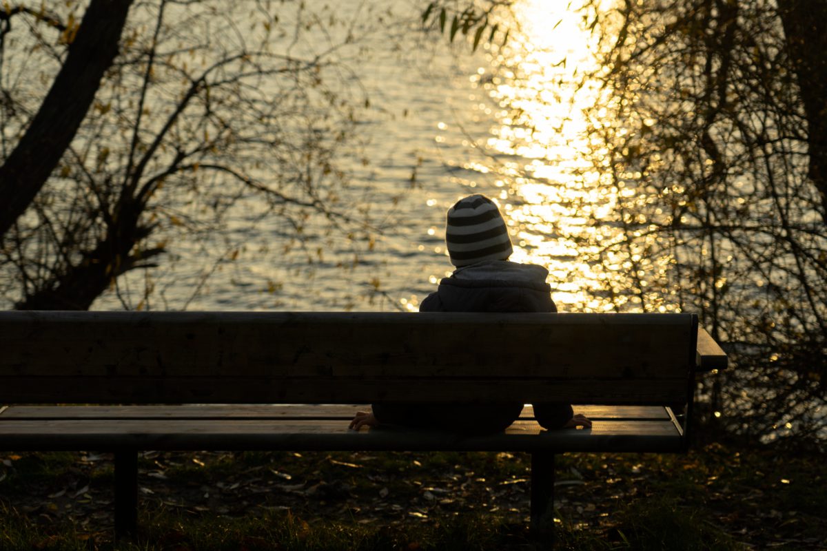 Representative image of a lonely child sitting on a bench at sunset | Photo by Arek Socha | Pixabay