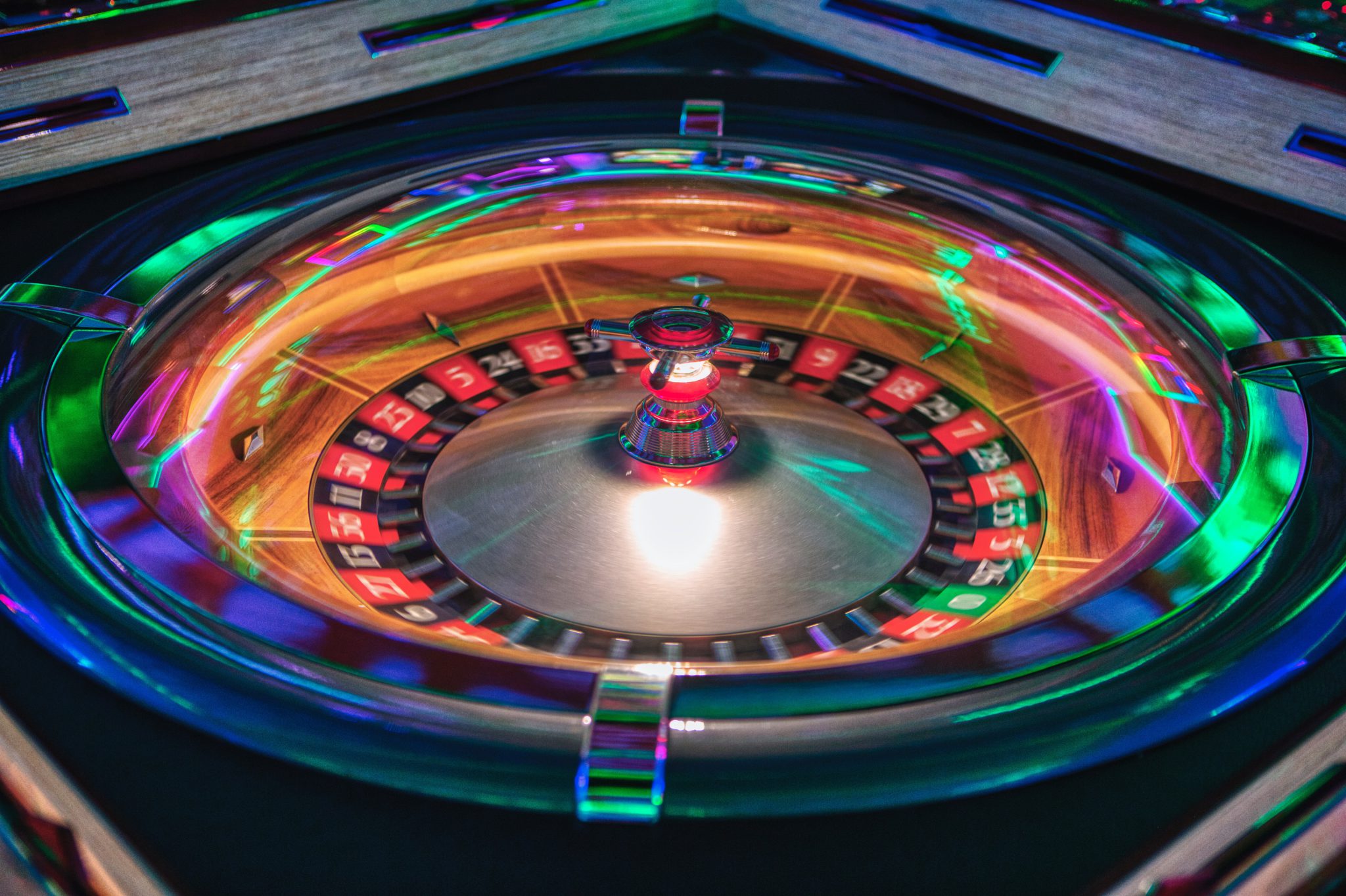 Representative image showing a spinning roulette wheel lit up by neon lights