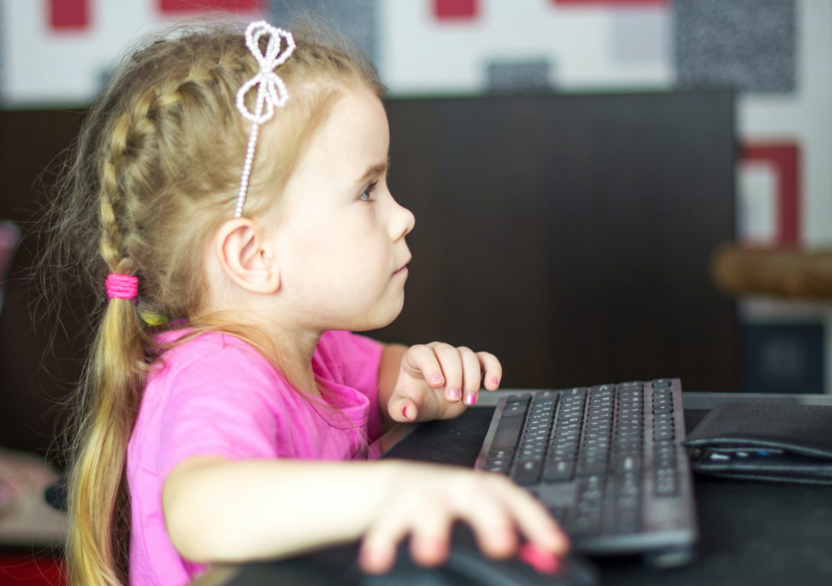 Little girl operating a computer | Photo by Bermix Studio on Unsplash