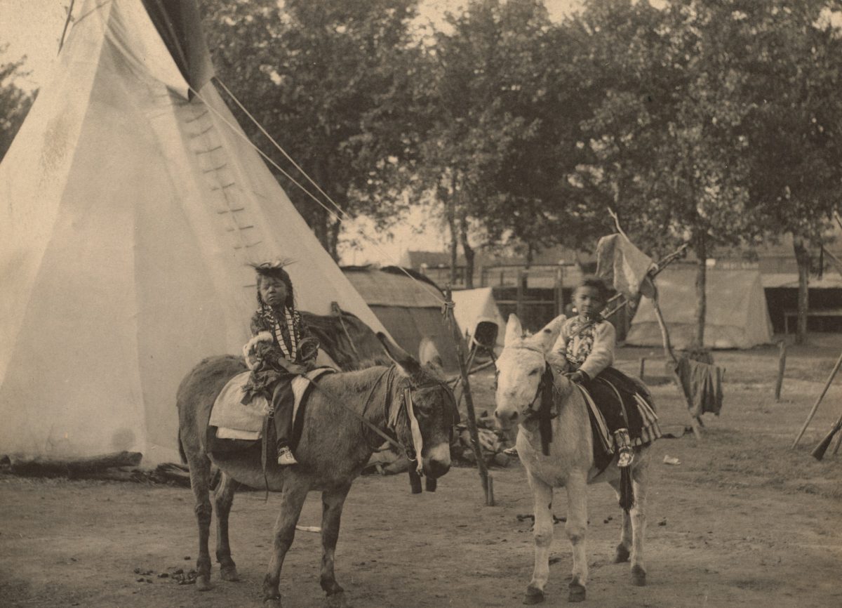 Representative historic photo of Native American children on horses | Photo by Boston Public Library on Unsplash