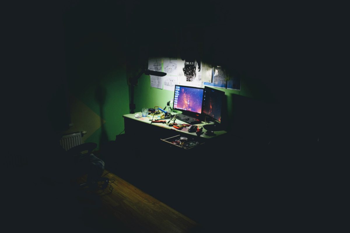 Representative photo showing a computer switched on in a dark room | Photo by Kaur Kristjan on Unsplash