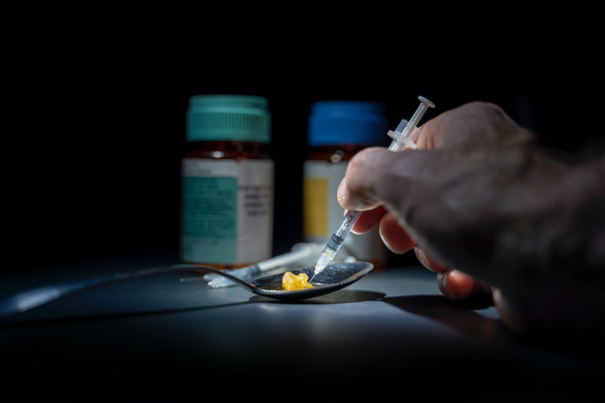 Representative photo showing bottles of drugs, and a syringe | Photo by Michael Longmire on Unsplash