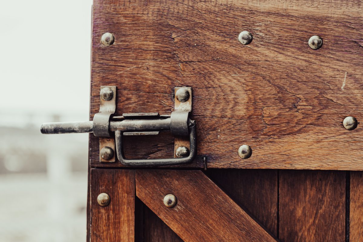 Picture of a wooden door with a steel lock