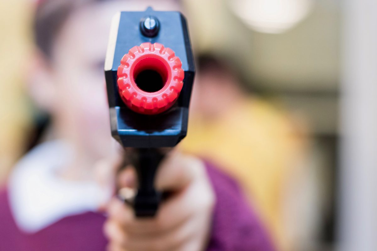Representative image of a toy-like gun being pointed right into the camera | Photo by Lavi Perchik on Unsplash